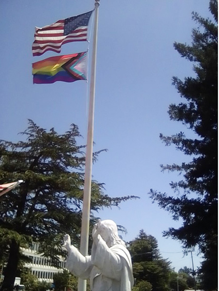 Rainbow flag above the Sacred Heart